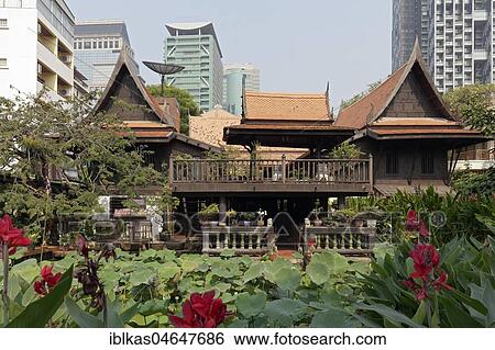 Traditional Thai wooden house on stilts in modern district, M. R. Kukrit's House, Museum, Sathorn, Bangkok, Thailand, Asia View Large Photo Image Stock Photograph - Traditional Thai wooden house on stilts in modern district, M. R. Kukrit's House, Museum, Sathorn, Bangkok, Thailand, Asia. Fotosearch