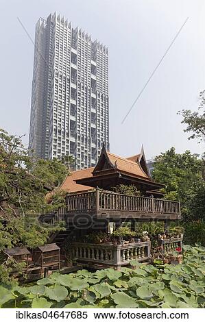 Traditional Thai wooden house on stilts in modern district, M. R. Kukrit's House, Museum, Sathorn, Bangkok, Thailand, Asia View Large Photo Image Stock Photography - Traditional Thai wooden house on stilts in modern district, M. R. Kukrit's House, Museum, Sathorn, Bangkok, Thailand, Asia. Fotosearch