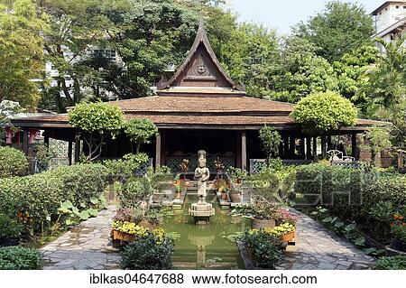 Stock Photo - Traditional Thai wooden house with Khmer-style garden, M. R. Kukrit's House, Museum, Sathorn, Bangkok, Thailand, Asia. Fotosearch
