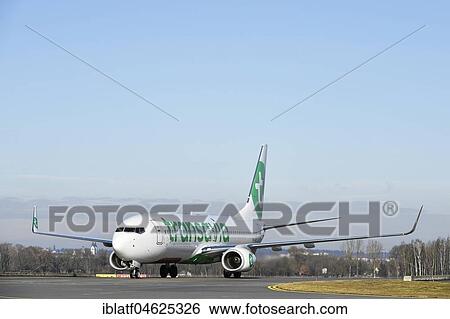 Stock Photograph - Transavia, Boeing B737-800, rolling on runway, Munich Airport, Germany, Europe. Fotosearch