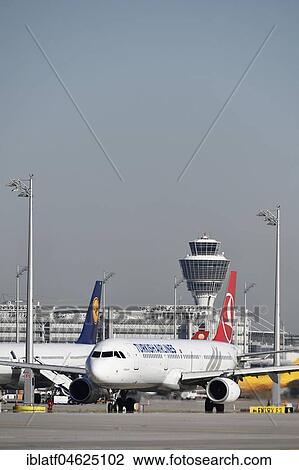 Turkish Airlines, plane rolls onto runway with tower in the background, Munich Airport, Upper Bavaria, Germany, Europe View Large Photo Image Stock Image - Turkish Airlines, plane rolls onto runway with tower in the background, Munich Airport, Upper Bavaria, Germany, Europe. Fotosearch
