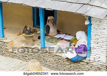 Two aged Nepalese women sitting in the doorway and sewing, Dhampus Mountain village, Nepal, Asia View Large Photo Image Stock Image - Two aged Nepalese women sitting in the doorway and sewing, Dhampus Mountain village, Nepal, Asia. Fotosearch