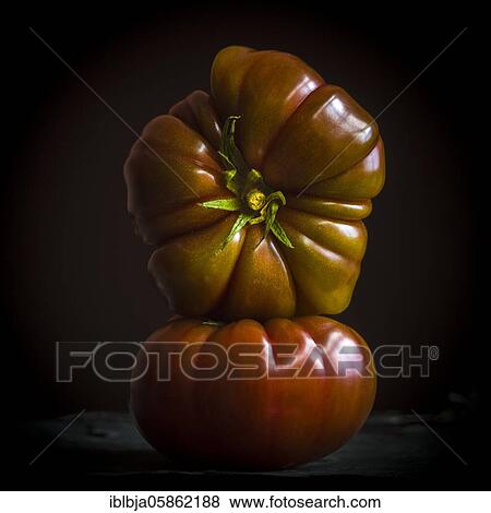Two black Crimean tomatoes, studio shot, France, Europe View Large Photo Image Stock Photo - Two black Crimean tomatoes, studio shot, France, Europe. Fotosearch