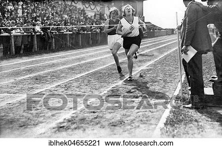 Stock Image - Two female runners at the finish line, sports, athletics, 1930s, exact location unknown, Germany, Europe. Fotosearch