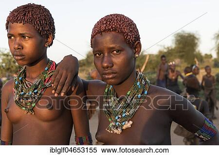 Two girls with necklaces, ca. 15 -16 years, Hamer tribe, portrait, Turmi, region of southern nations, nationalities and peoples, Ethiopia, Africa View Large Photo Image Stock Photography - Two girls with necklaces, ca. 15 -16 years, Hamer tribe, portrait, Turmi, region of southern nations, nationalities and peoples, Ethiopia, Africa. Fotosearch