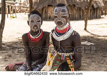 Stock Image - Two girls with traditional face painting, Karo tribe, Southern Nations Nationalities and Peoples' Region, Ethiopia, Africa. Fotosearch
