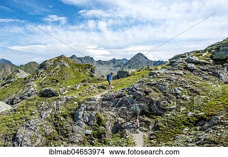 Picture - Two hikers on Schladminger Höhenweg, Schladminger Tauern, Schladming, Styria, Austria, Europe. Fotosearch