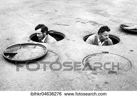 Two men work in two gullies, ca. 1970s, exact place unknown, France, Europe View Large Photo Image Stock Photograph - Two men work in two gullies, ca. 1970s, exact place unknown, France, Europe. Fotosearch