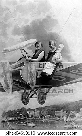 Two women with a bottle of sparkling wine in an aircraft mock-up, New Year's Eve, 1920s, Germany, Europe View Large Photo Image Stock Image - Two women with a bottle of sparkling wine in an aircraft mock-up, New Year's Eve, 1920s, Germany, Europe. Fotosearch