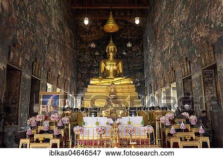 Stock Photo - Ubosot with Buddha statue Phra Putthra Tri Lokachet and murals, Wat Suthat, Royal Temple, Phra Nakhon, Bangkok, Thailand, Asia. Fotosearch