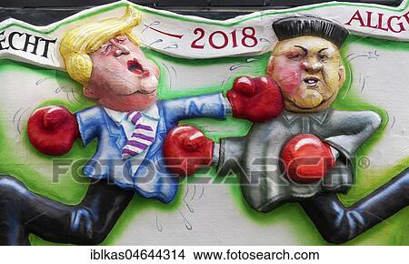 Picture - US President Donald Trump boxing versus North Korean President Kim Jong-un, political caricature, motto caravan during Carnival Monday procession 2018, Düsseldorf, North Rhine-Westphalia, Germany, Europe. Fotosearch