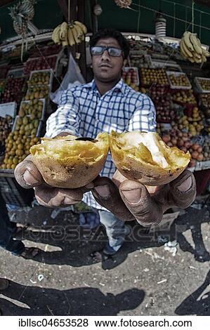 Vendor with vegetable stand offers his goods, Dewas, Madhya Pradesh, India, Asia View Large Photo Image Stock Photo - Vendor with vegetable stand offers his goods, Dewas, Madhya Pradesh, India, Asia. Fotosearch