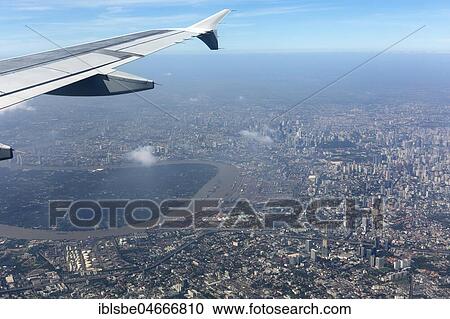 View from a plane with wing on city centre, aerial view, Bangkok, Thailand, Asia View Large Photo Image Stock Image - View from a plane with wing on city centre, aerial view, Bangkok, Thailand, Asia. Fotosearch