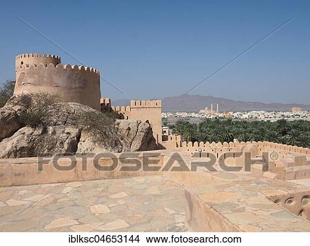 Picture - View from fortress Nakhl on town Nakhl with palm oasis, Nakhl, Oman, Asia. Fotosearch