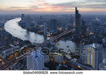 View from Lebua State Tower with Chao Phraya River, bridge to Khlong San, dusk, Bang Rak District, Bangkok, Thailand, Asia View Large Photo Image Stock Photo - View from Lebua State Tower with Chao Phraya River, bridge to Khlong San, dusk, Bang Rak District, Bangkok, Thailand, Asia. Fotosearch