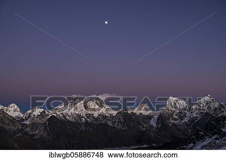 View in the evening light with moon from Renjo La Pass 5417m to the east to Himalaya with Pumori, Changtse, Mount Everest 8848m, Nuptse 7864m, Lhotse 8516m, Makalu 8485m, Cholatse. Khumbu, Nepal, Himalaya, Asia View Large Photo Image Stock Photo - View in the evening light with moon from Renjo La Pass 5417m to the east to Himalaya with Pumori, Changtse, Mount Everest 8848m, Nuptse 7864m, Lhotse 8516m, Makalu 8485m, Cholatse. Khumbu, Nepal, Himalaya, Asia. Fotosearch