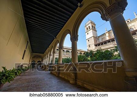 Stock Photography - View of the church tower through arcades, cloister and courtyard with orange trees in the monastery, Monasterio de San Jerónimo, Granada, Andalusia, Spain, Europe. Fotosearch