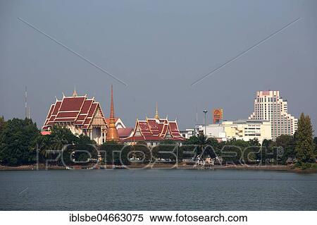 View over Lake Kaen Nakhon to Wat That At Bueng and Pullmann Hotel, Khon Kaen, Isan, Thailand, Asia View Large Photo Image Stock Photography - View over Lake Kaen Nakhon to Wat That At Bueng and Pullmann Hotel, Khon Kaen, Isan, Thailand, Asia. Fotosearch