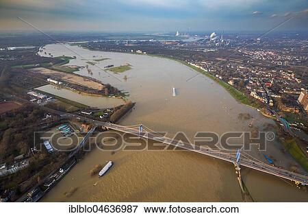 Stock Photo - View over the Friedrich-Ebert-Bridge at flood on rhine, Duisburg, Ruhr Area, North Rhine-Westphalia, Germany, Europe. Fotosearch