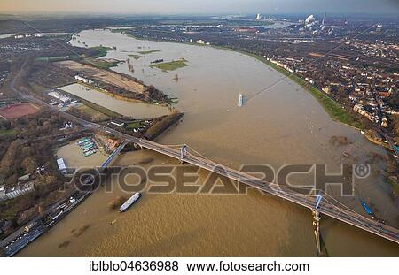 Stock Photo - View over the Friedrich-Ebert-Bridge at flood on rhine, Duisburg, Ruhr Area, North Rhine-Westphalia, Germany, Europe. Fotosearch