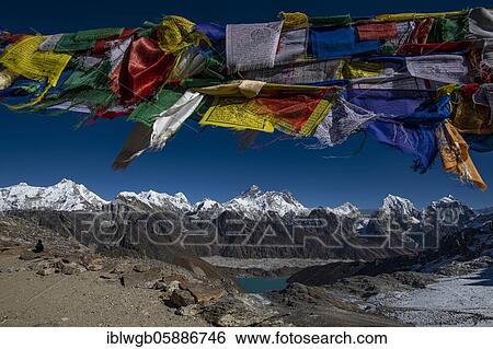 View with Buddhist prayer flags from Renjo La Pass 5417m to the east to Himalaya with Pumori, Changtse, Mount Everest 8848m, Nuptse 7864m, Lhotse 8516m, Makalu 8485m, Cholatse. In front Gokyo Lake and Ngozumba Glacier. Khumbu, Nepal, Asia View Large Photo Image Stock Photograph - View with Buddhist prayer flags from Renjo La Pass 5417m to the east to Himalaya with Pumori, Changtse, Mount Everest 8848m, Nuptse 7864m, Lhotse 8516m, Makalu 8485m, Cholatse. In front Gokyo Lake and Ngozumba Glacier. Khumbu, Nepal, Asia. Fotosearch
