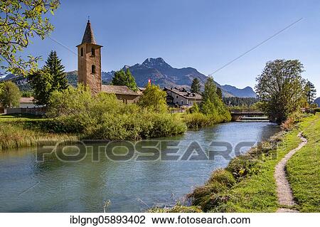 Stock Image - Village church Sils Baselgia on the banks of the Inn, Sils Maria, Inn, Inn Valley, Bernina Alps, Upper Engadine, Engadine, Grisons, Switzerland, Europe. Fotosearch