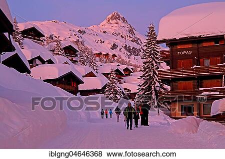 Stock Photo - Village road with deep snow against Bettmerhorn 2872m at dusk, Bettmeralp, Aletsch area, Oberwallis, Valais, Switzerland, Europe. Fotosearch