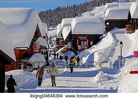 Picture - Village road with snow-covered chalets, Bettmeralp, Aletsch area, Upper Valais, Valais, Switzerland, Europe. Fotosearch