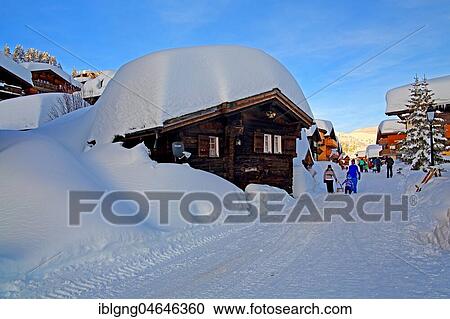 Stock Image - Village road with snow-covered chalets, Bettmeralp, Aletsch area, Upper Valais, Valais, Switzerland, Europe. Fotosearch