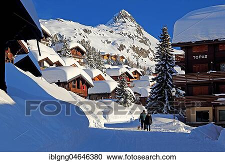 Stock Image - Village road with snow-covered chalets, in the back Bettmerhorn 2872m, Bettmeralp, Aletsch area, Upper Valais, Valais, Switzerland, Europe. Fotosearch