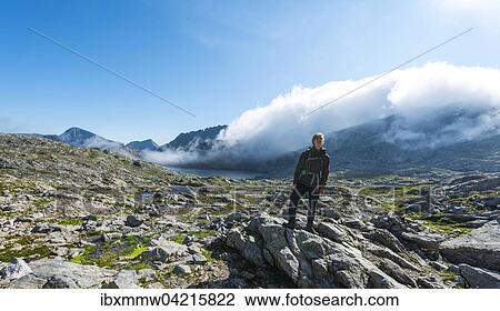 Wanderer steht auf Felsen, Klafferkessel mit vielen kleinen Bergseen, Oberer Klaffersee, Greifenberg, Rohrmoos-Untertal, Schladminger Tauern, Steiermark, Osterreich, Europa View Large Photo Image Stock Image - Wanderer steht auf Felsen, Klafferkessel mit vielen kleinen Bergseen, Oberer Klaffersee, Greifenberg, Rohrmoos-Untertal, Schladminger Tauern, Steiermark, Osterreich, Europa. Fotosearch