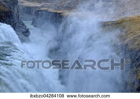 Wasserfall Gullfoss mit aufsteigender Gischt bei starkem Wind, Island, Europa View Large Photo Image Stock Photo - Wasserfall Gullfoss mit aufsteigender Gischt bei starkem Wind, Island, Europa. Fotosearch