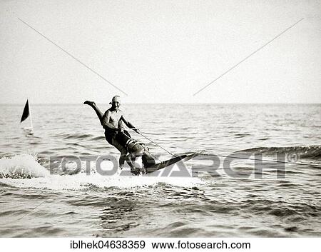 Stock Photo - Water ski acrobatics, ca. 1930s, exact place unknown, Germany, Europe. Fotosearch