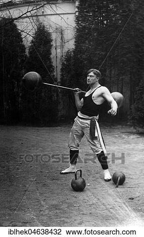 Stock Image - Weightlifter, man training, ca. 1929, 1920s, exact location unknown, Germany, Europe. Fotosearch