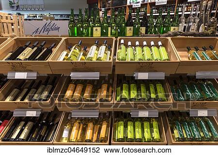 Wine bottles in a supermarket, Germany, Europe View Large Photo Image Stock Image - Wine bottles in a supermarket, Germany, Europe. Fotosearch