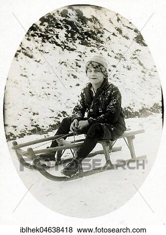 Stock Photo - Winter sports, boy sledding, 1920s, exact location unknown, Germany, Europe. Fotosearch