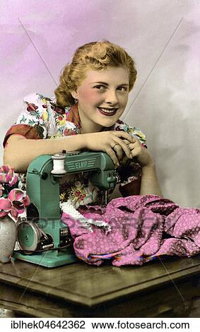Woman at a sewing machine, 1930s, Germany, Europe View Large Photo Image Stock Image - Woman at a sewing machine, 1930s, Germany, Europe. Fotosearch
