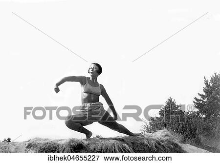 Woman doing outdoor gymnastics, 1940s, exact place unknown, Germany, Europe View Large Photo Image Stock Photo - Woman doing outdoor gymnastics, 1940s, exact place unknown, Germany, Europe. Fotosearch