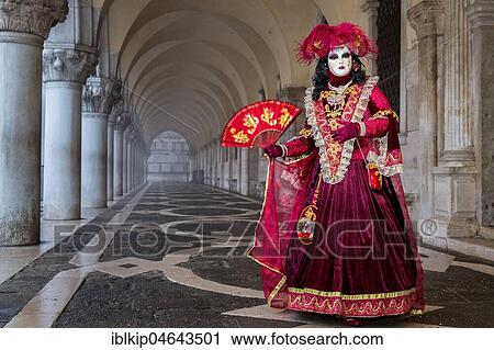 Stock Image - Woman dressed up for carnival in Venice, Italy, Europe. Fotosearch