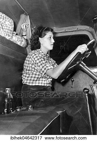 Stock Photo - Woman driving a truck, 1950s, Germany, Europe. Fotosearch