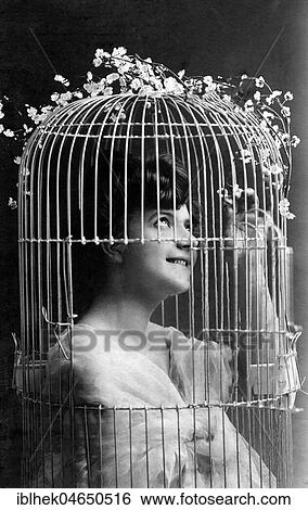 Stock Photograph - Woman in a birdcage, 1910s, Germany, Europe. Fotosearch