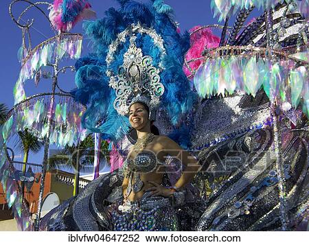 Stock Image - Woman in fanciful costume on carriage, carnival, street carnival, Puerto de la Cruz, Tenerife, Canary Islands, Spain, Europe. Fotosearch