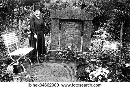 Stock Image - Woman mourning at grave, cemetery, 1930s, Germany, Europe. Fotosearch