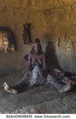 Woman of the Ovahimba or Himba people cleaning and disinfecting clothes and body, Kunene district, Namibia, Africa View Large Photo Image Stock Photography - Woman of the Ovahimba or Himba people cleaning and disinfecting clothes and body, Kunene district, Namibia, Africa. Fotosearch