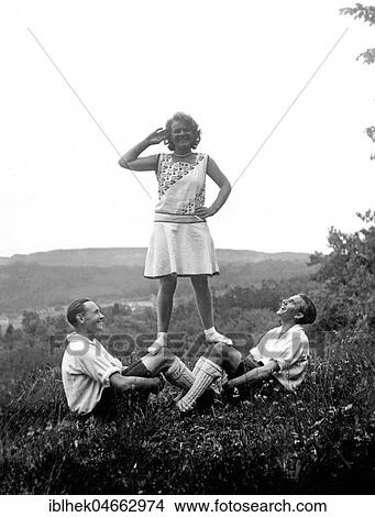 Woman on the knees of two men, 1930s, Germany, Europe View Large Photo Image Picture - Woman on the knees of two men, 1930s, Germany, Europe. Fotosearch