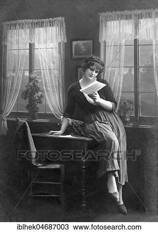 Stock Image - Woman reading Liebesbief, 1910s, Germany, Europe. Fotosearch