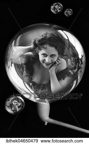 Stock Photo - Woman reflected in soap bubbles, 1920s, Germany, Europe. Fotosearch