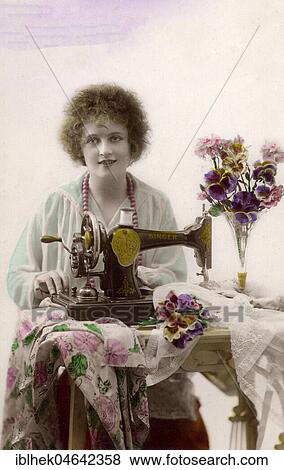 Stock Photo - Woman sewing with sewing machine, 1910s, Germany, Europe. Fotosearch