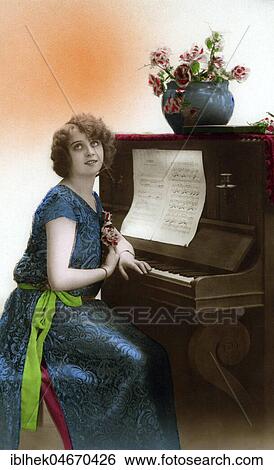 Stock Photograph - Woman Sitting Longingly at the Piano, 1910s, Germany, Europe. Fotosearch