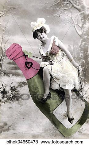 Stock Photo - Woman sitting on champagne bottle, New Year, New Year's Eve, 1910s, Germany, Europe. Fotosearch